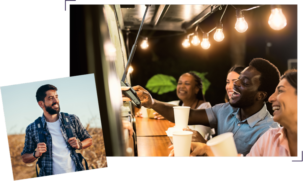 man smiling and group of friends at restaurant laughing